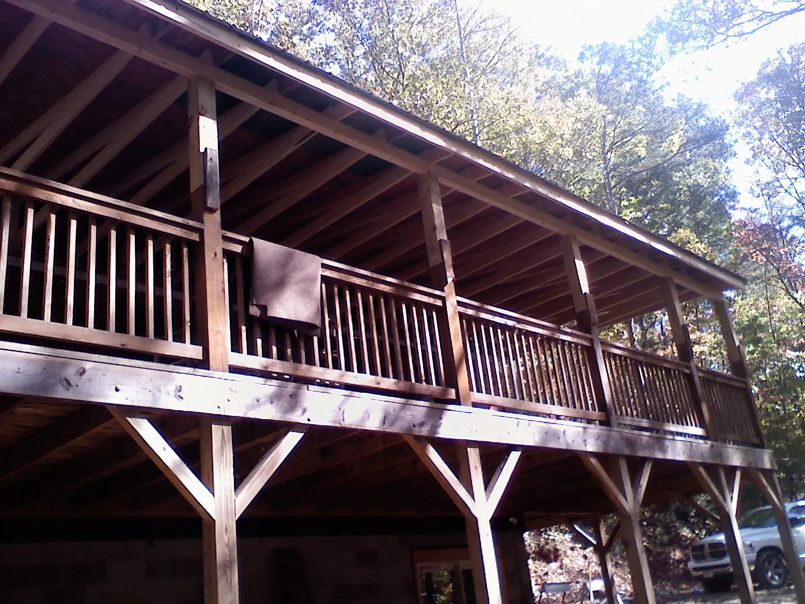 Timber framing under a new elevated porch and deck — Roof Leak Repair in Etna by Roofing Brothers