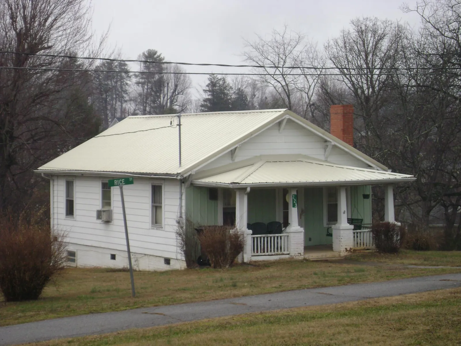 White metal roof on a craftsman bungalow at a street corner in Etna